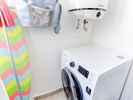 laundry room with washing machine-dryer